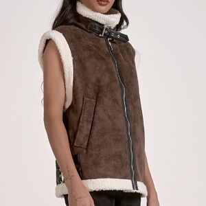 New w tags. Elan shearling lined vest. Faux leather buckles.